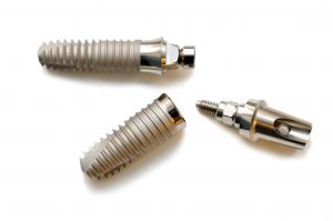 Photo of dental implants used to replace missing teeth. They act as the tooth root.