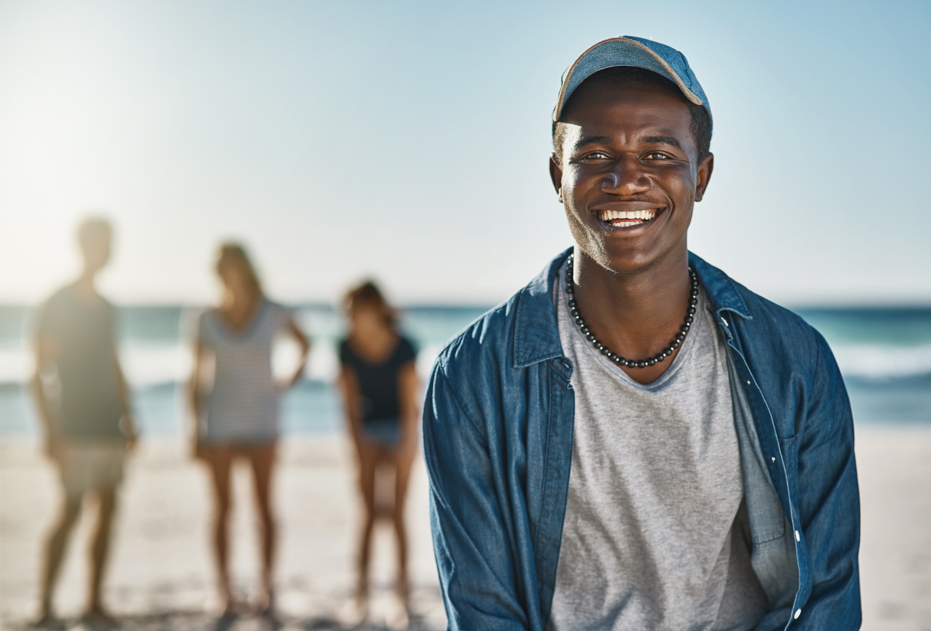 a patient smiling after his wisdom tooth extraction because he chose Mahogany Oral Surgery as his "pull wisdom teeth near me" location